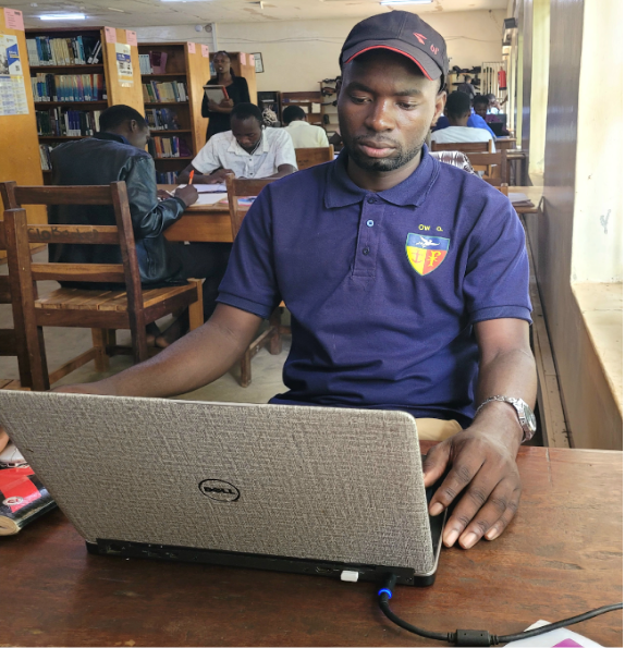 Student researching in the library